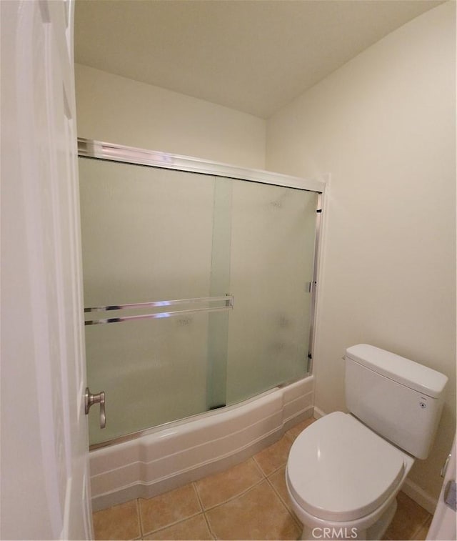 23230 Orange Ave Unit 2, Lake Forest, CA 92630 - full bathroom with toilet, tile patterned floors, and bath / shower combo with glass door