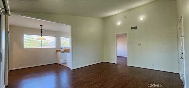 23230 Orange Ave Unit 2, Lake Forest, CA 92630 - empty room with dark wood-style floors, baseboards, and lofted ceiling