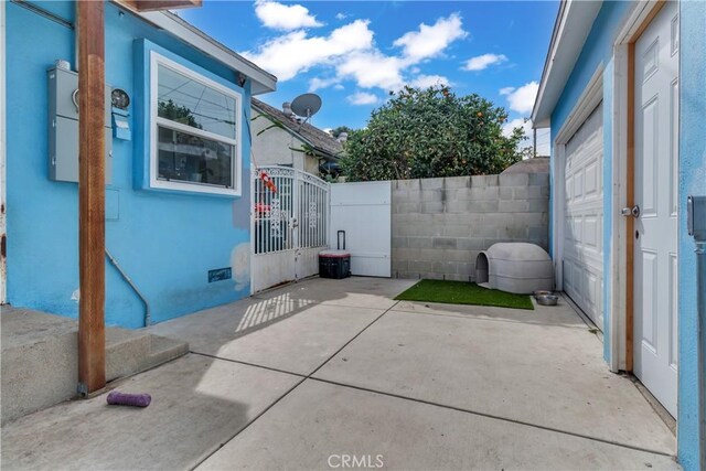 view of patio / terrace with fence and a gate