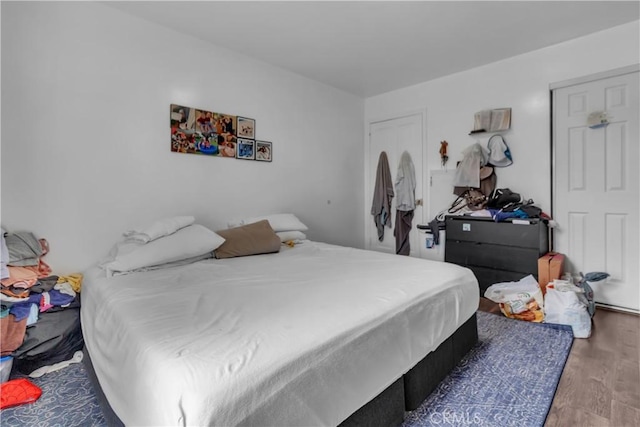 bedroom featuring wood finished floors