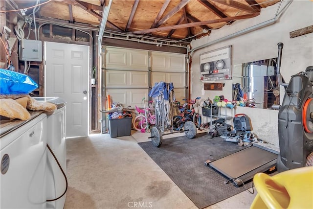 garage with washer / clothes dryer and electric panel