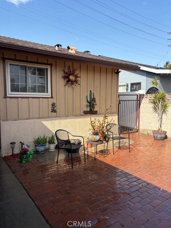 view of patio featuring fence