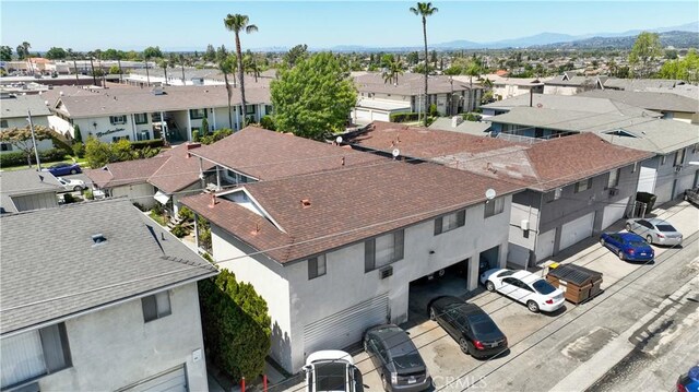 birds eye view of property featuring a mountain view and a residential view