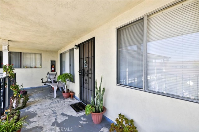 doorway to property with stucco siding