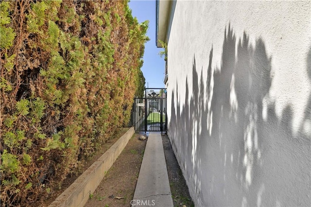 view of property exterior featuring a gate