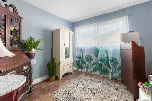 sitting room featuring wood finished floors and baseboards