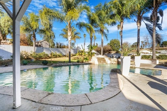 view of swimming pool featuring a fenced backyard and a fenced in pool