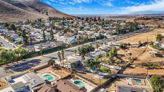 drone / aerial view with a residential view and a mountain view