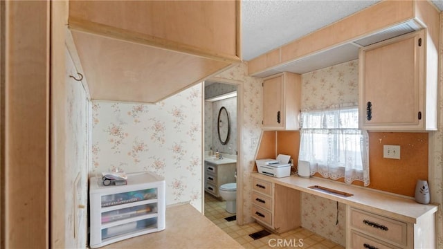 bathroom with vanity, tile patterned floors, toilet, and wallpapered walls