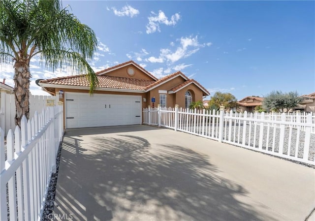 ranch-style home with a fenced front yard, a garage, a tile roof, driveway, and stucco siding