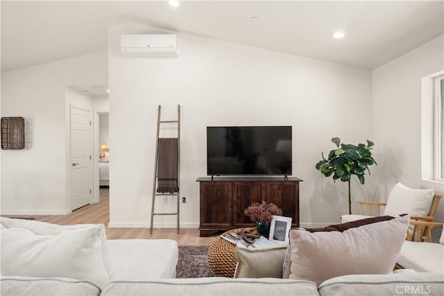 living area with recessed lighting, a wall mounted AC, vaulted ceiling, wood finished floors, and baseboards