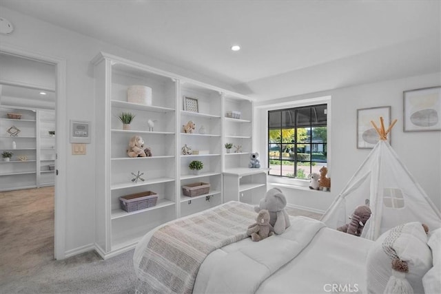 carpeted bedroom featuring recessed lighting and baseboards