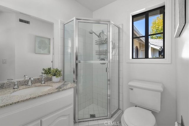 full bath featuring vanity, visible vents, toilet, and a stall shower