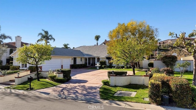 view of front of home featuring driveway and an attached garage