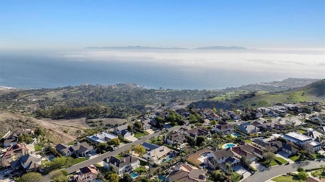 drone / aerial view with a residential view and a water view