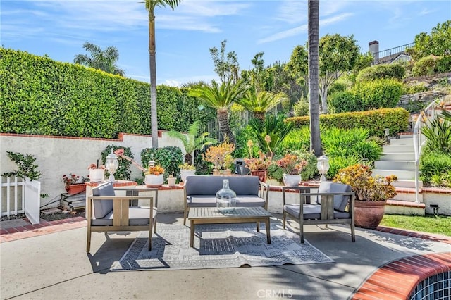 view of patio / terrace with outdoor lounge area and stairs