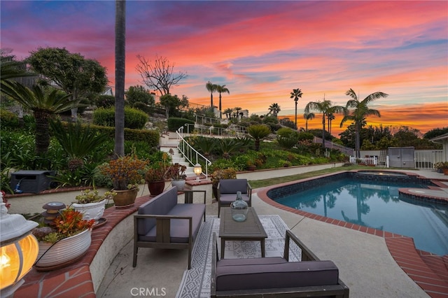 view of swimming pool featuring a patio area, stairs, an outdoor hangout area, and a pool with connected hot tub