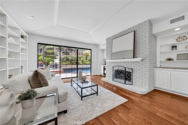21 Santa Catalina Dr, Rancho Palos Verdes, CA 90275 - living area featuring a fireplace, wood finished floors, and built in shelves