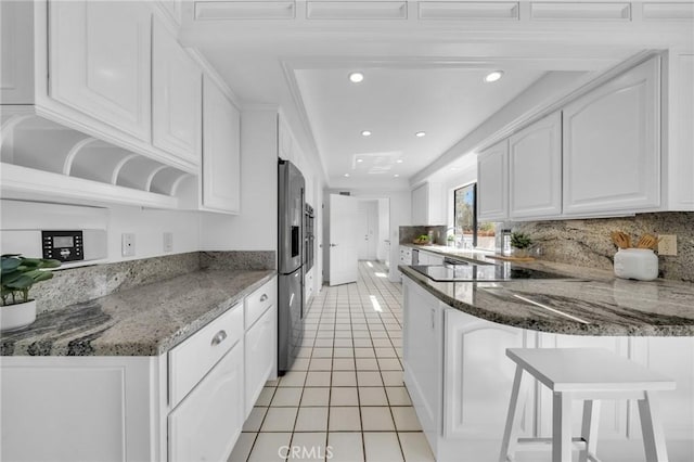 21 Santa Catalina Dr, Rancho Palos Verdes, CA 90275 - kitchen featuring light tile patterned floors, white cabinets, a peninsula, recessed lighting, and backsplash