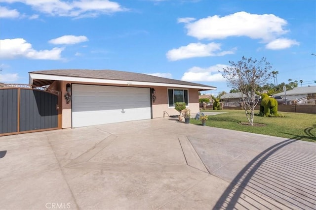 single story home with an attached garage, driveway, a front yard, and stucco siding