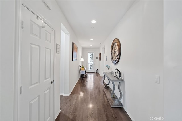 hall featuring recessed lighting, baseboards, and dark wood-style floors