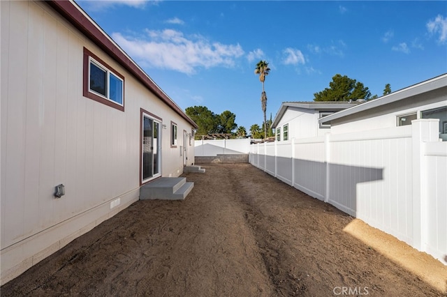 view of home's exterior with crawl space and a fenced backyard