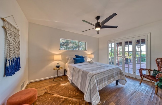 bedroom featuring visible vents, access to outside, wood finished floors, and a ceiling fan