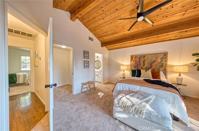 carpeted bedroom with wooden ceiling, visible vents, vaulted ceiling with beams, and baseboards