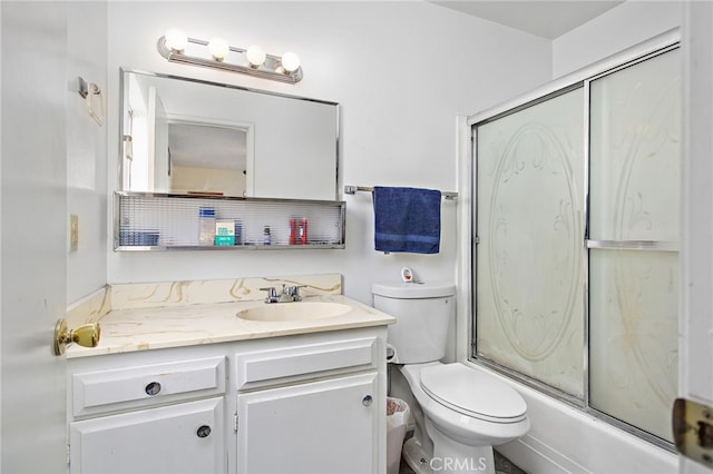 full bath featuring toilet, enclosed tub / shower combo, and vanity