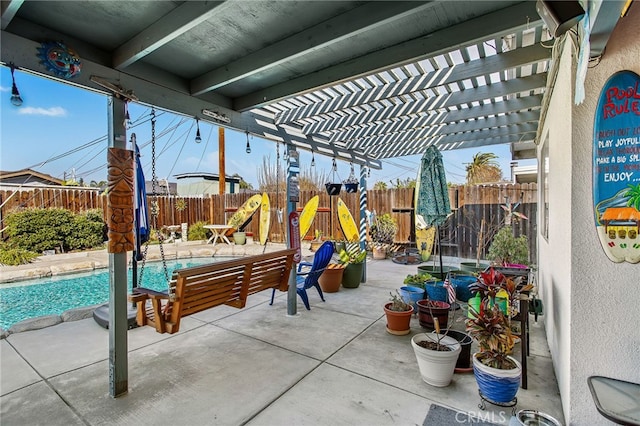 view of patio / terrace featuring a fenced backyard, a fenced in pool, and a pergola