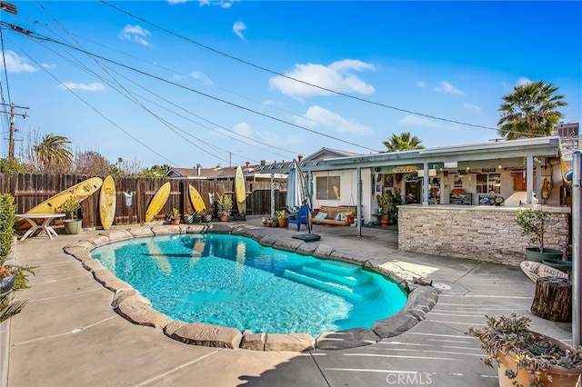 view of swimming pool with a patio area, a fenced backyard, and a fenced in pool