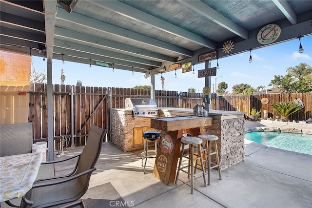 view of patio / terrace featuring an outdoor kitchen, a fenced backyard, outdoor wet bar, area for grilling, and a fenced in pool