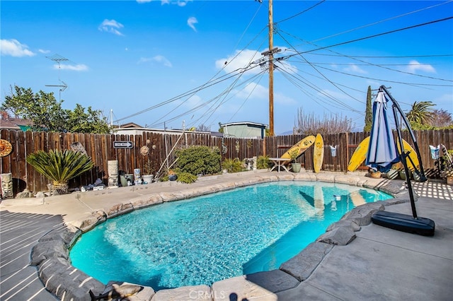 view of pool featuring a fenced in pool, a fenced backyard, and a patio