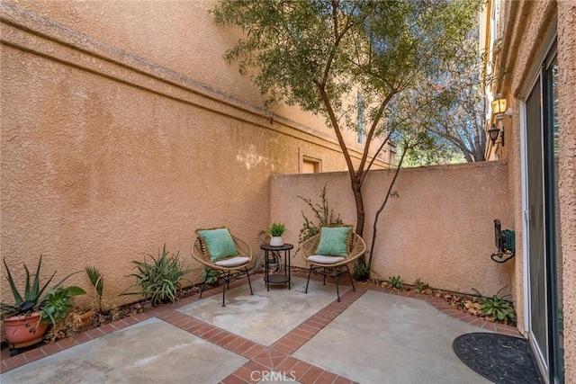 view of patio featuring fence