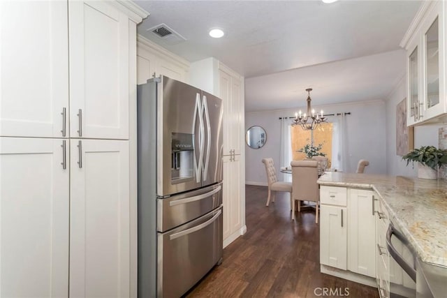 kitchen featuring dark wood-style flooring, visible vents, appliances with stainless steel finishes, glass insert cabinets, and white cabinetry