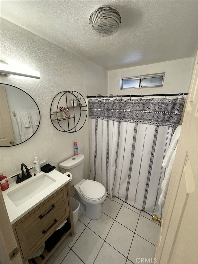 bathroom with a textured wall, toilet, a textured ceiling, vanity, and tile patterned flooring