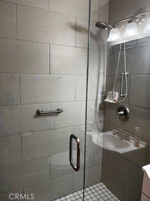 full bath with a shower stall