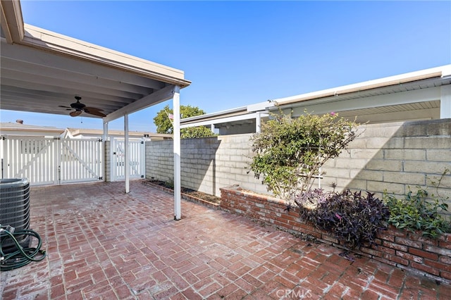 3902 Vista Campana N Unit 45, Oceanside, CA 92057 - view of patio / terrace featuring a gate, ceiling fan, fence, and cooling unit