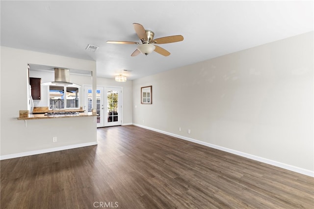 3902 Vista Campana N Unit 45, Oceanside, CA 92057 - unfurnished living room featuring visible vents, baseboards, french doors, a ceiling fan, and dark wood finished floors