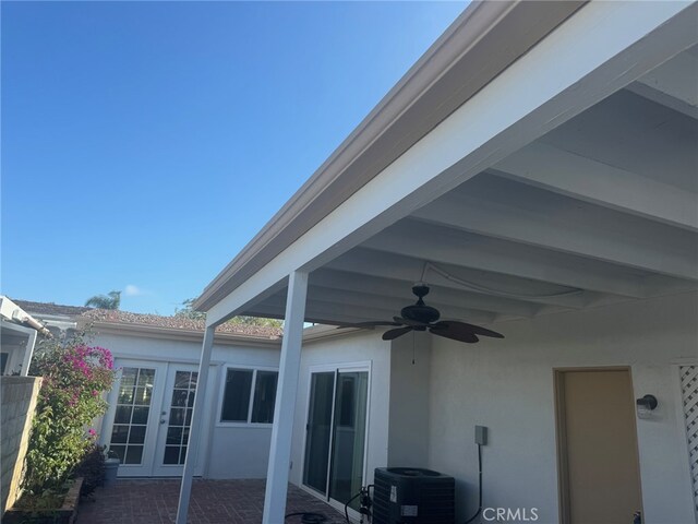 3902 Vista Campana N Unit 45, Oceanside, CA 92057 - exterior space with central air condition unit, a ceiling fan, french doors, and stucco siding