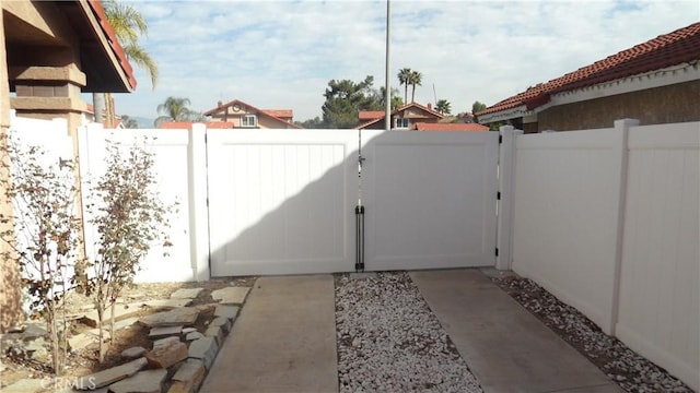 view of gate with fence