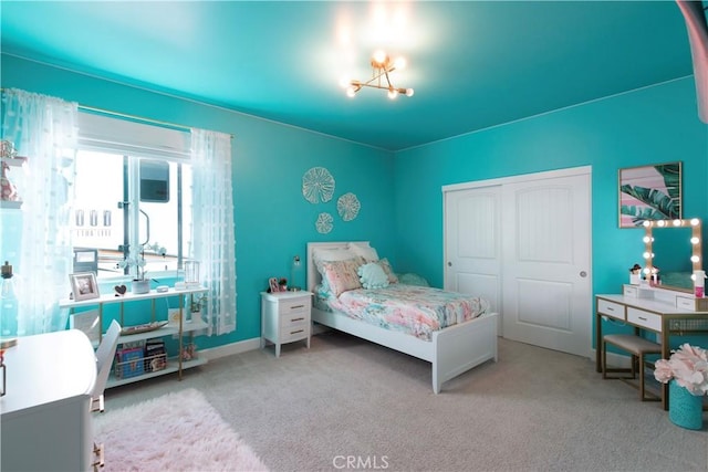 carpeted bedroom featuring a closet