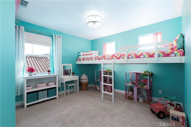 bedroom with carpet, visible vents, and baseboards