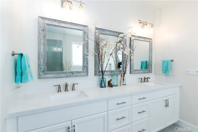 bathroom featuring double vanity and a sink