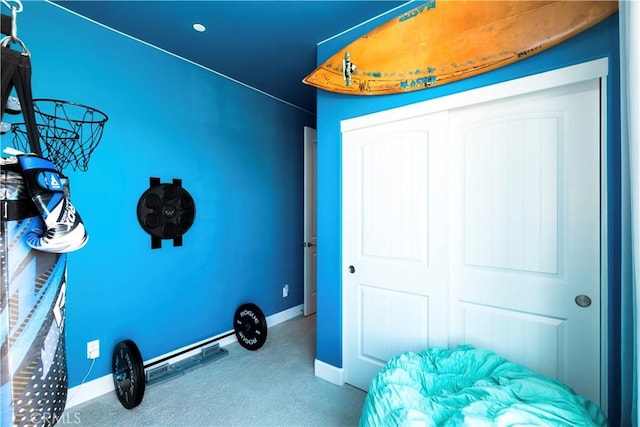 workout area with carpet flooring and baseboards