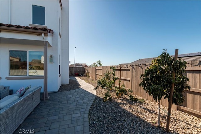 view of yard featuring a patio area and a fenced backyard