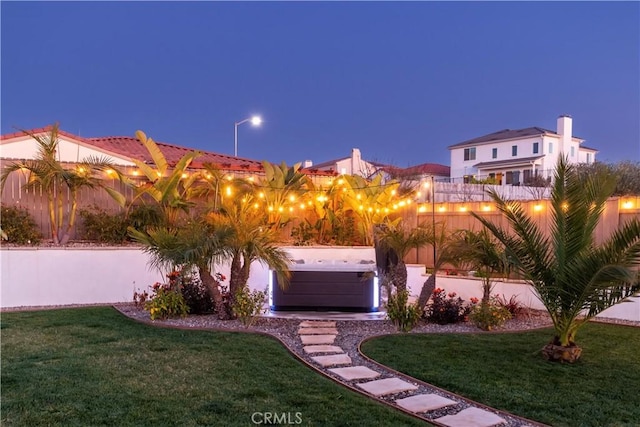 view of yard with a hot tub