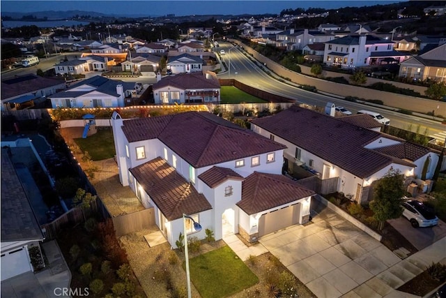 birds eye view of property with a residential view