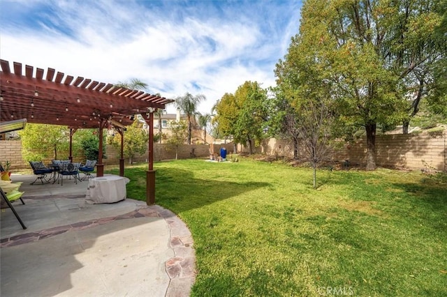 view of yard with a fenced backyard, a pergola, and a patio