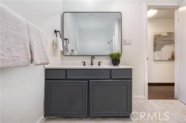 bathroom featuring vanity and baseboards